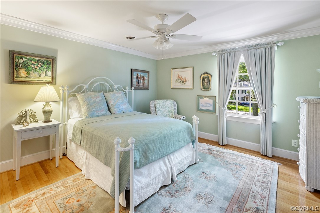 2731 Arrandell Road Midlothian, VA 23113 - Photo 19 of 30 a bedroom with a large bed and a chandelier