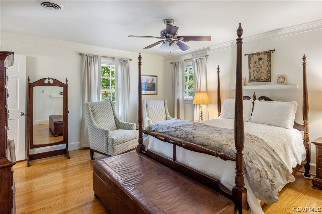 2731 Arrandell Road Midlothian, VA 23113 - Photo 22 of 30 a bedroom with a large bed and a chandelier