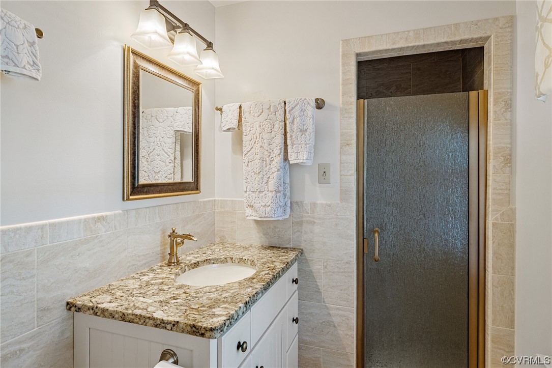 2731 Arrandell Road Midlothian, VA 23113 - Photo 23 of 30 a bathroom with a granite countertop sink and a mirror