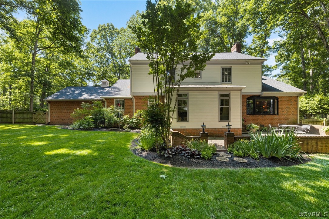 2731 Arrandell Road Midlothian, VA 23113 - Photo 28 of 30 a front view of a house with a garden and plants