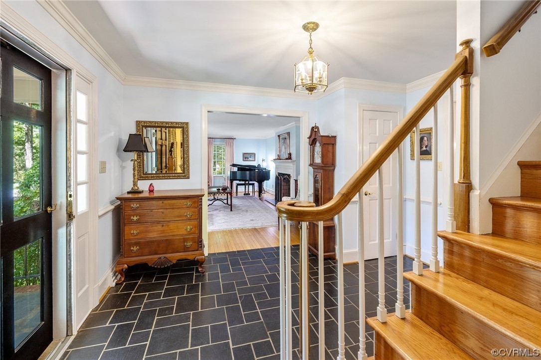 2731 Arrandell Road Midlothian, VA 23113 - Photo 4 of 30 a view of an entryway with dining room and stairs