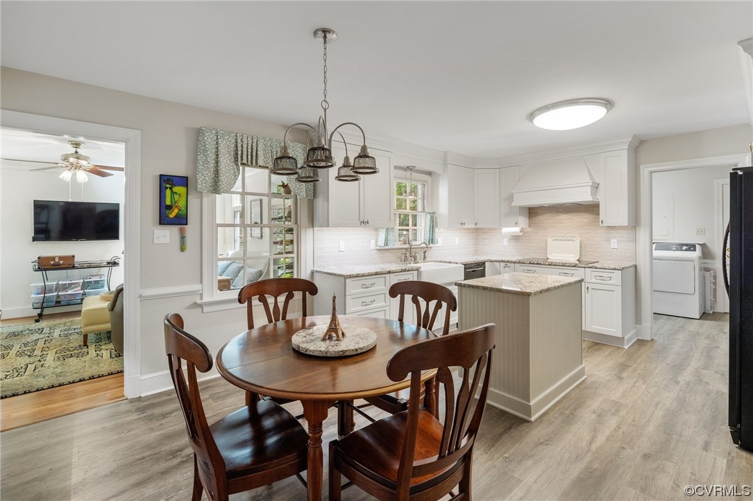 2731 Arrandell Road Midlothian, VA 23113 - Photo 9 of 30 a kitchen with stainless steel appliances kitchen island granite countertop a dining table chairs and microwave