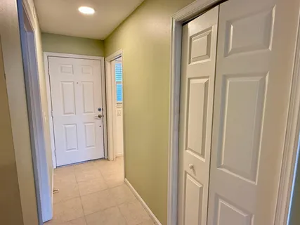 a view of a hallway with closet area