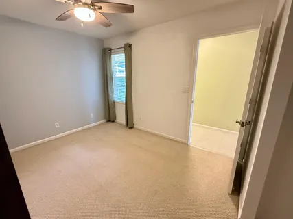 an empty room with windows and entrance