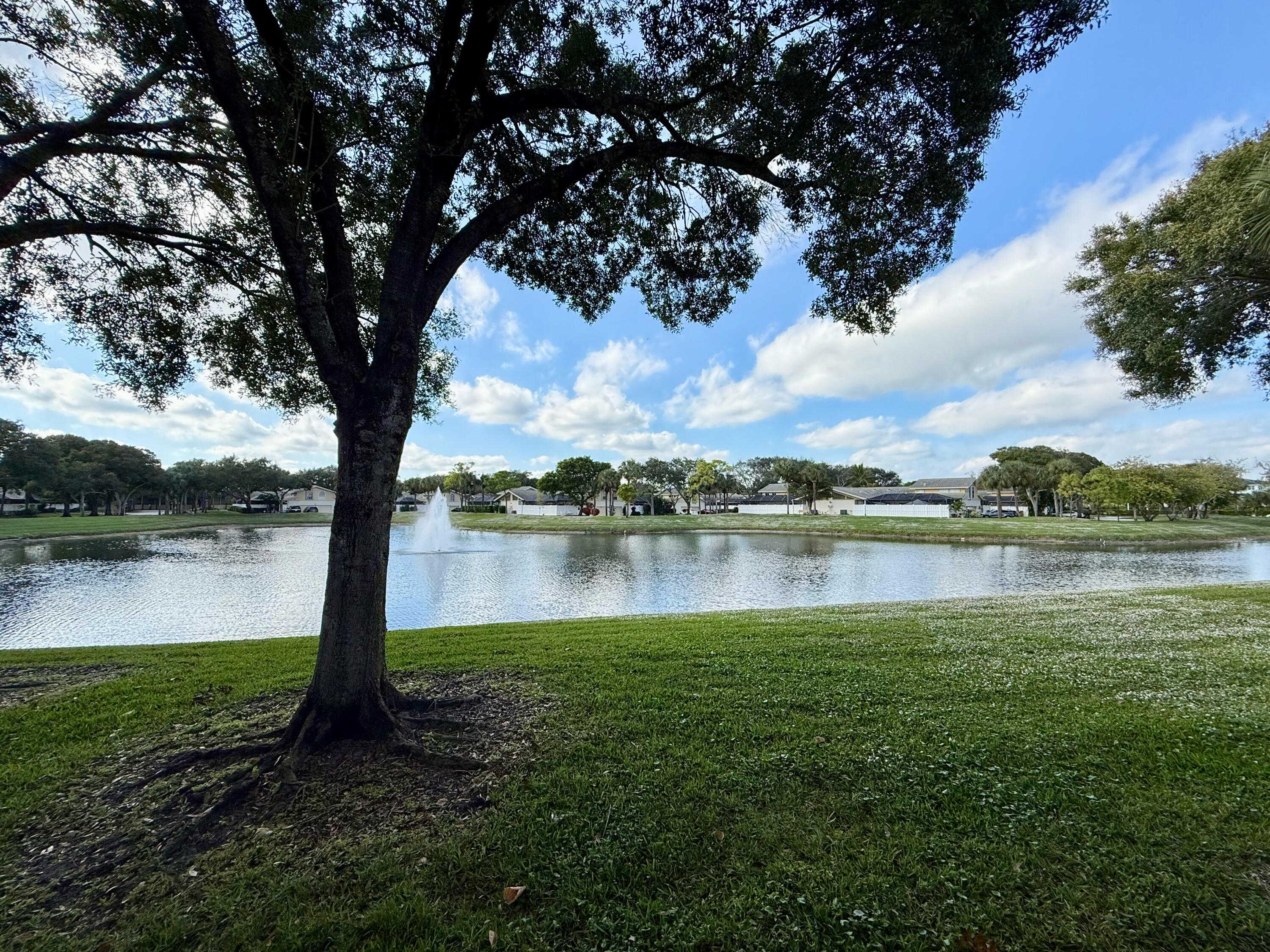 12813 Woodmill Drive Palm Beach Gardens, FL 33418 - Photo 2 of 30 a view of a lake