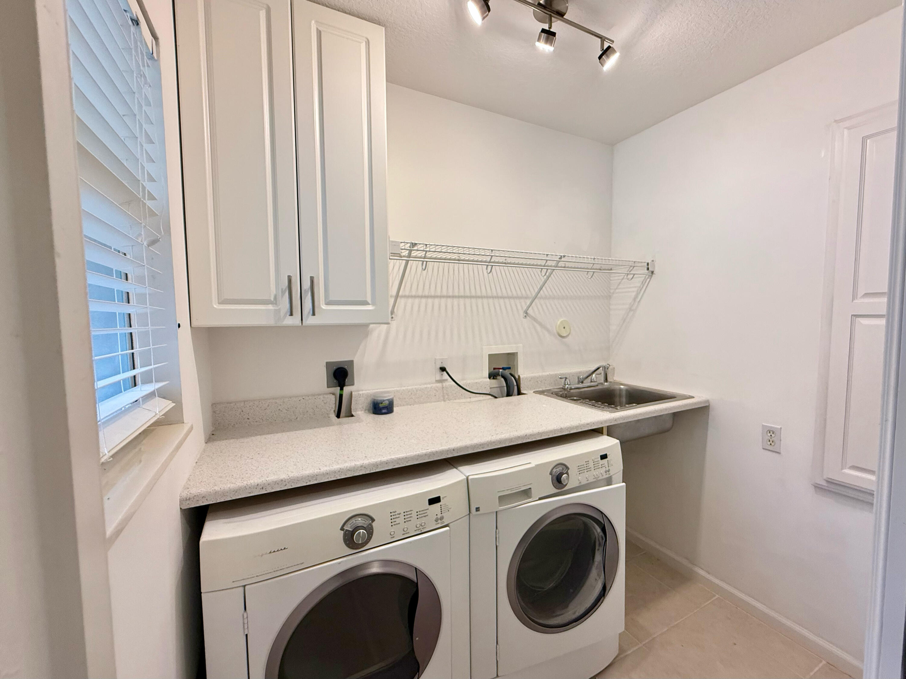 12813 Woodmill Drive Palm Beach Gardens, FL 33418 - Photo 21 of 30 a utility room with dryer and washer