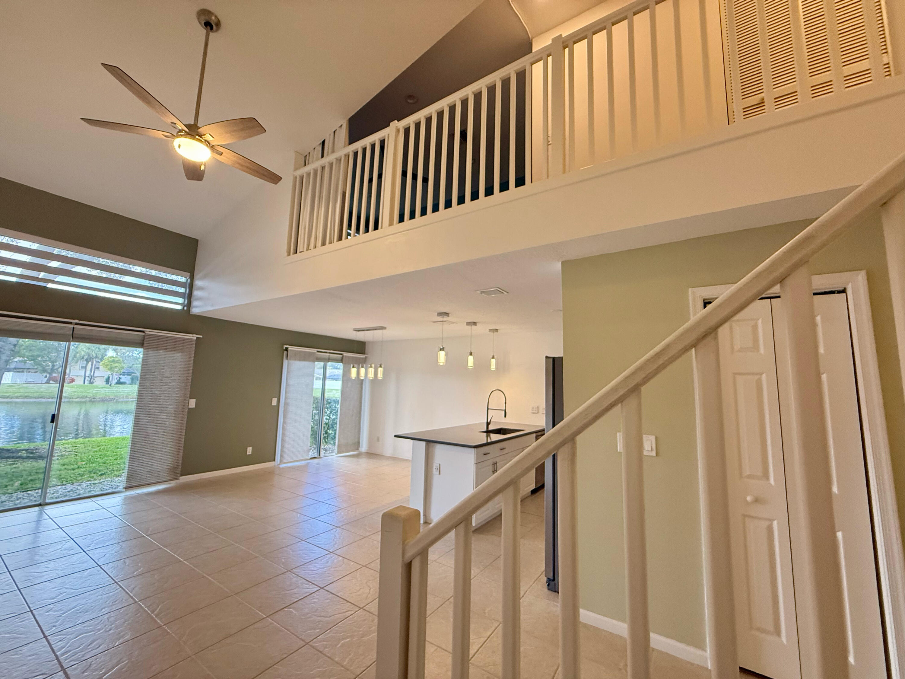 12813 Woodmill Drive Palm Beach Gardens, FL 33418 - Photo 3 of 30 a view of an entryway with wooden floor