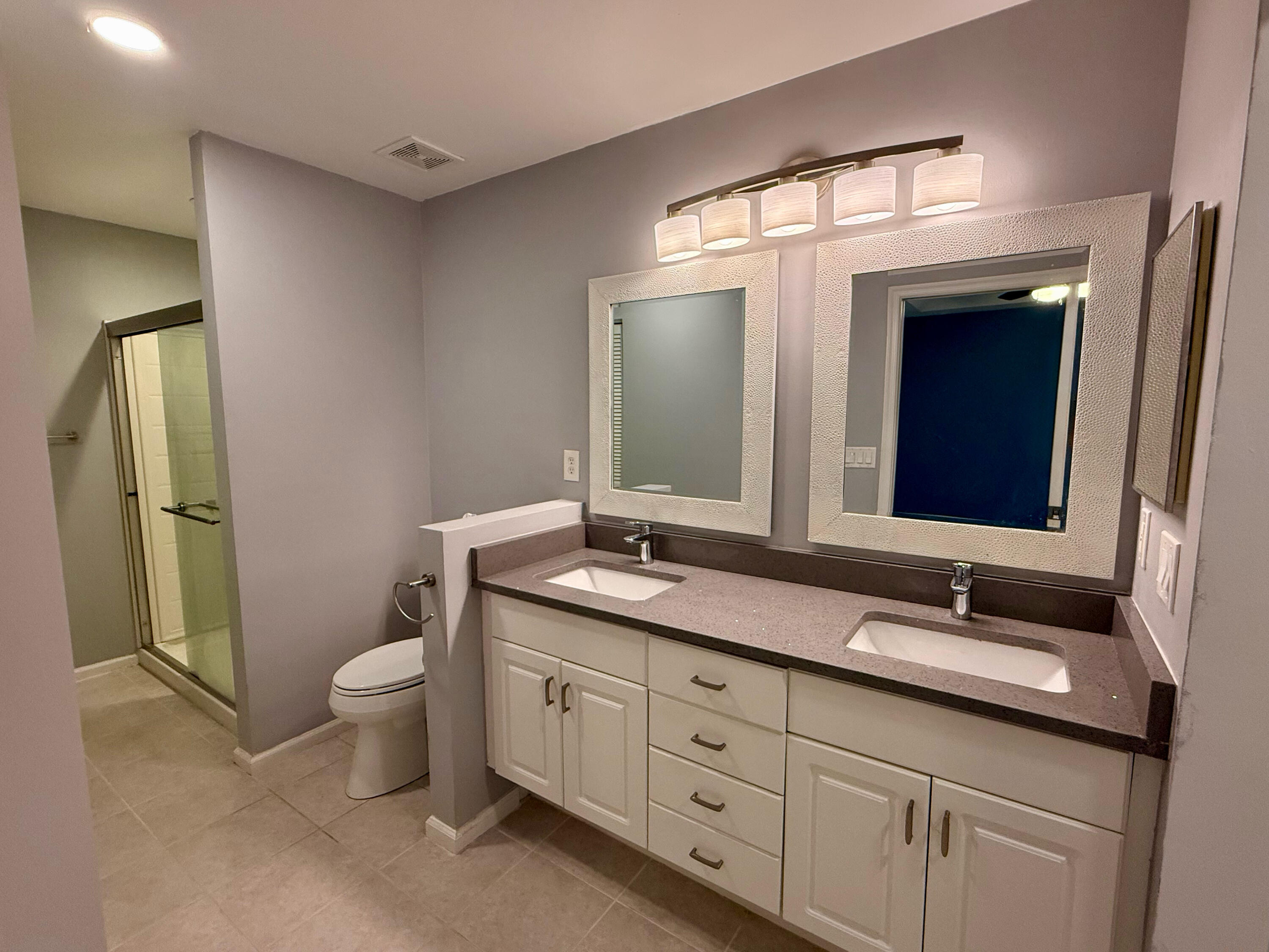 12813 Woodmill Drive Palm Beach Gardens, FL 33418 - Photo 10 of 30 a bathroom with a granite countertop sink mirror and toilet