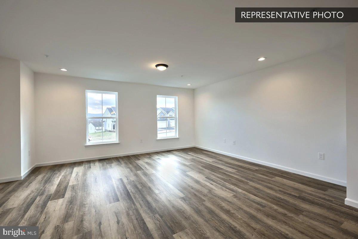 730 Fawn Way Pennsburg, PA 18073 - Photo 12 of 19 an empty room with wooden floor and windows