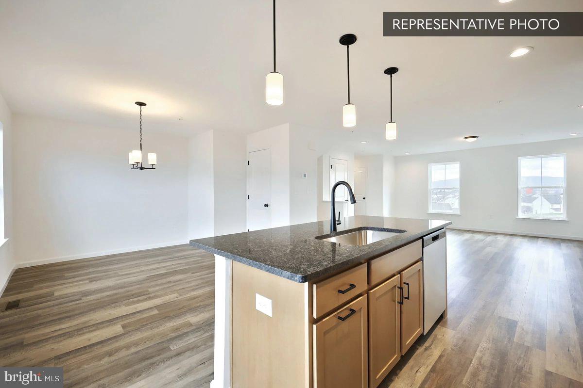 730 Fawn Way Pennsburg, PA 18073 - Photo 6 of 19 a kitchen with sink a window and wooden floor