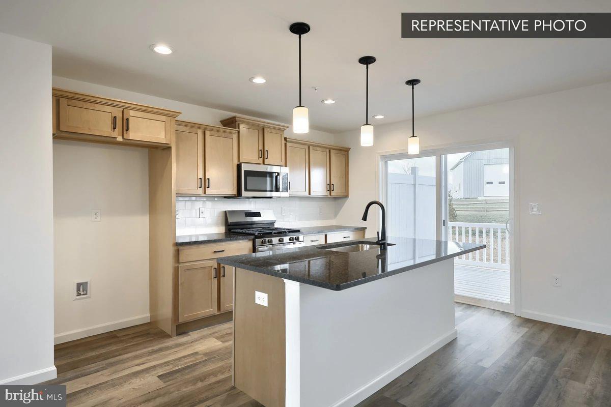 730 Fawn Way Pennsburg, PA 18073 - Photo 8 of 19 a kitchen that has a lot of cabinets and stainless steel appliances