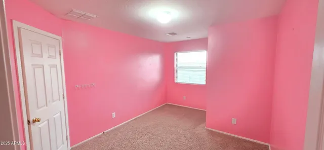 a view of a hallway with a window