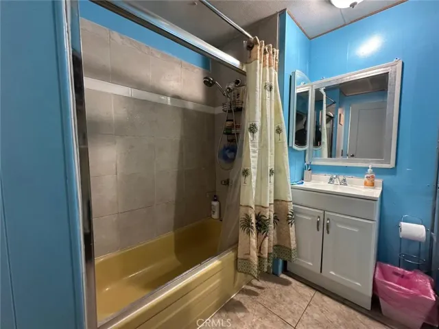 a bathroom with a shower and a sink