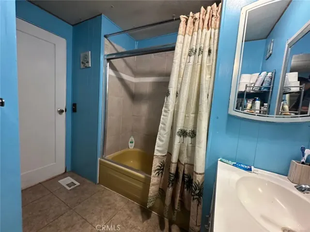 a bathroom with a bathtub and shower