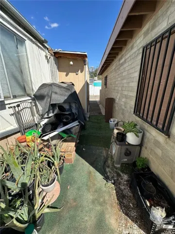 a vase of flowers sitting on a table in front of a window