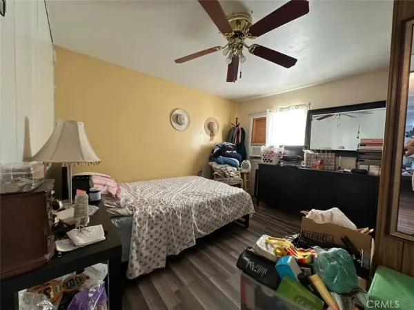 a bed room with bed and a window