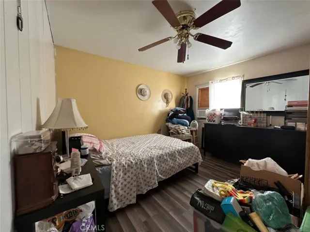 a bedroom with bed and a chandelier