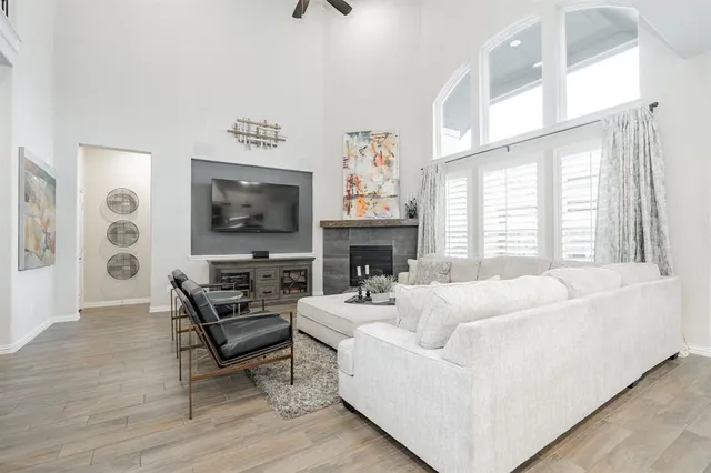 a living room with fireplace furniture and a flat screen tv