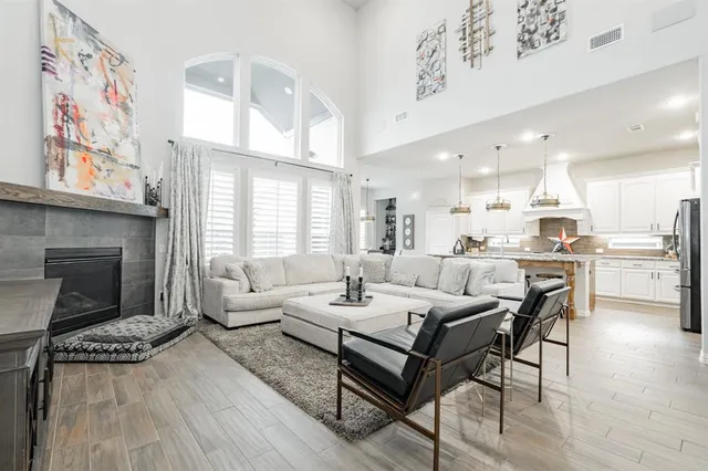 a living room with furniture and a fireplace