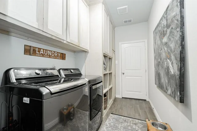 a utility room with washer and dryer