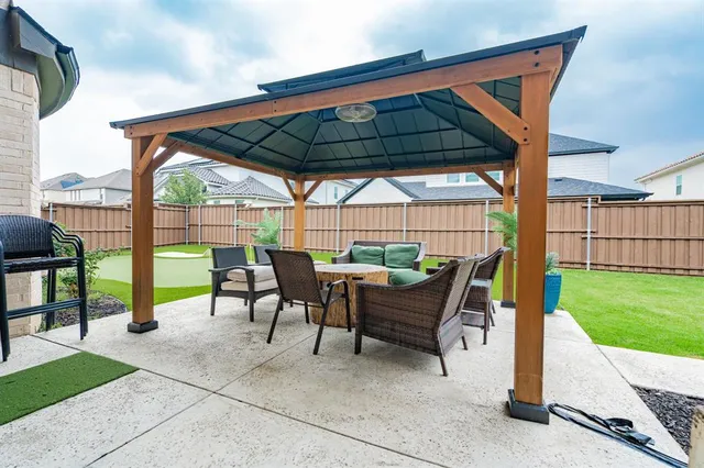 a view of yard with patio