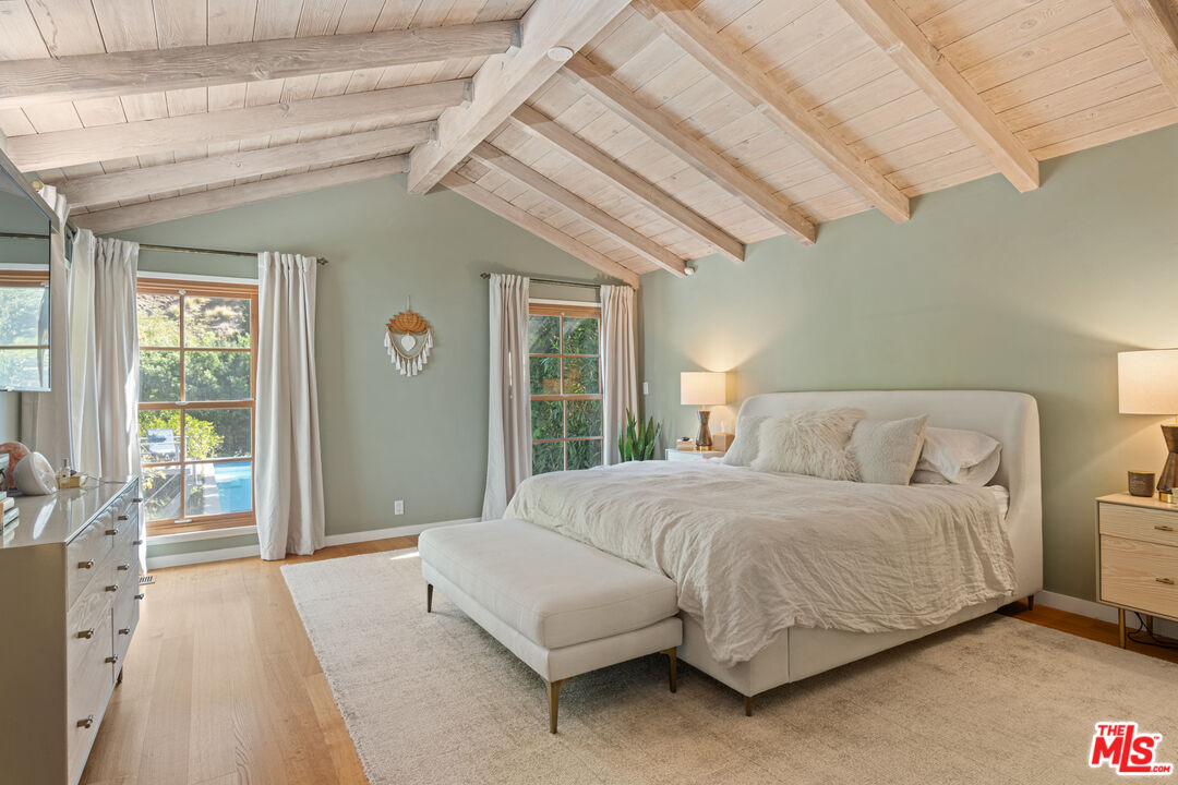 1853 Nichols Canyon Road Los Angeles, CA 90046 - Photo 17 of 48 a bedroom with a bed and a large window