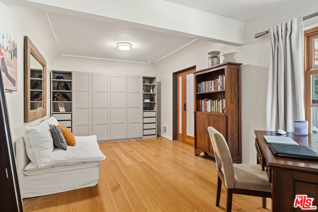 1853 Nichols Canyon Road Los Angeles, CA 90046 - Photo 19 of 48 a bedroom with a bed and a window