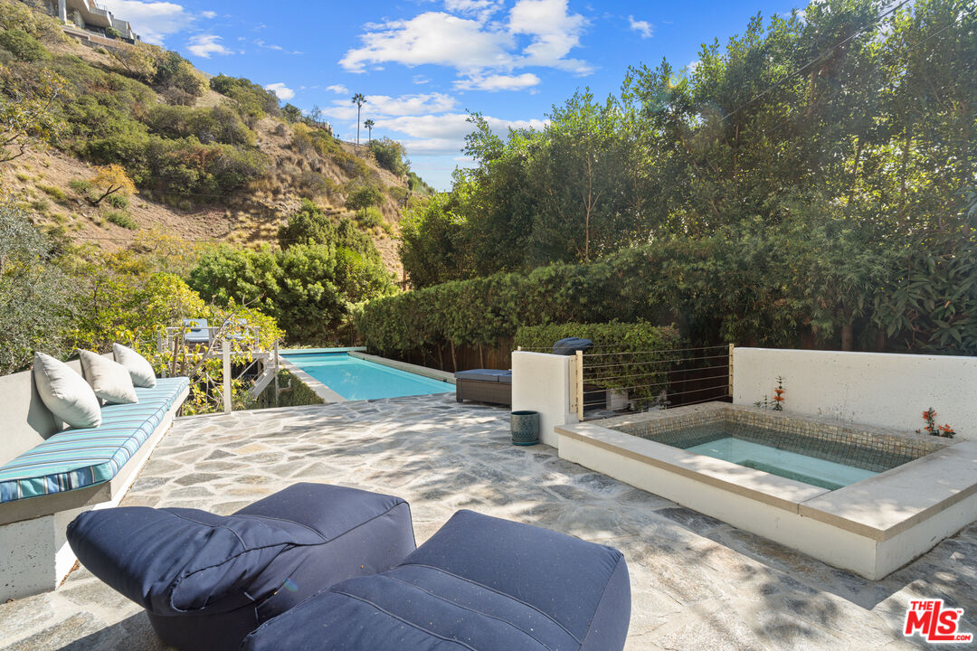 1853 Nichols Canyon Road Los Angeles, CA 90046 - Photo 2 of 48 a view of a swimming pool with a patio