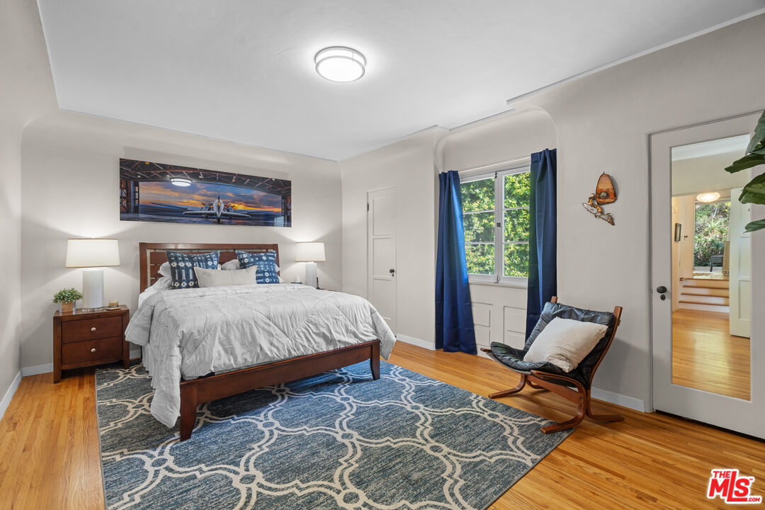 1853 Nichols Canyon Road Los Angeles, CA 90046 - Photo 22 of 48 a bedroom with a bed and chair