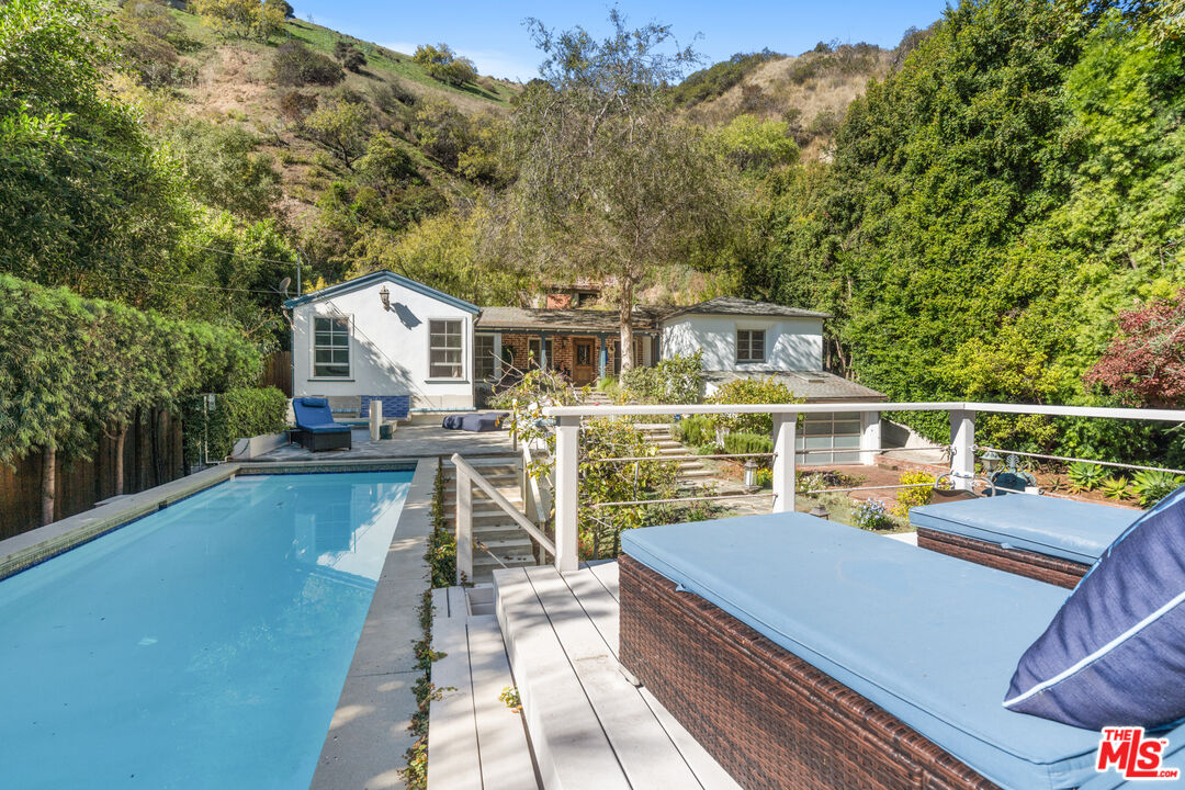 1853 Nichols Canyon Road Los Angeles, CA 90046 - Photo 32 of 48 a view of a house with wooden deck and outdoor space
