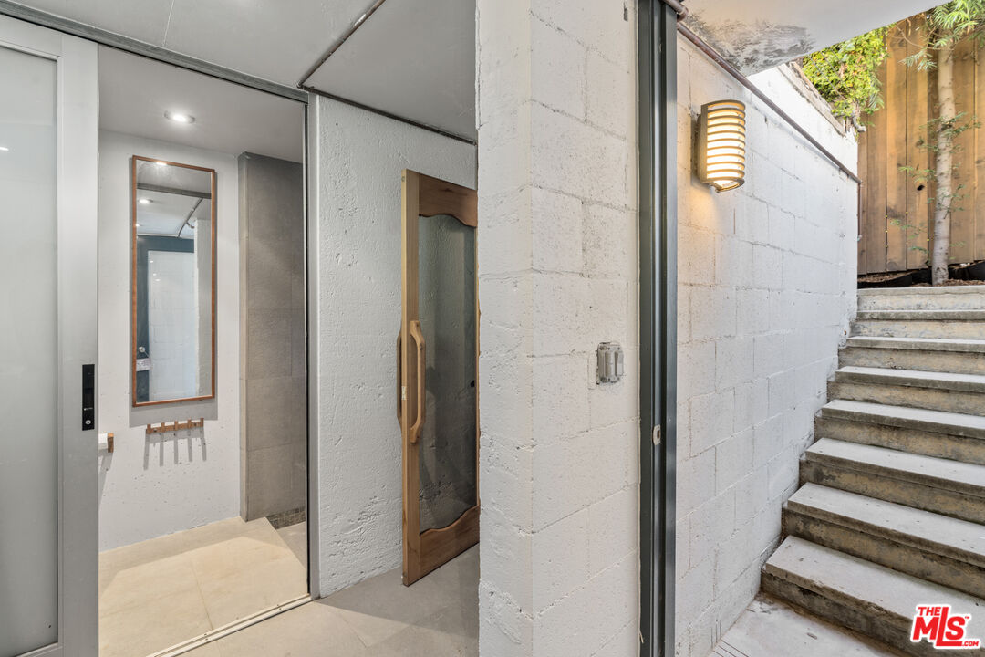 1853 Nichols Canyon Road Los Angeles, CA 90046 - Photo 33 of 48 a view of a hallway with wooden floor and entryway