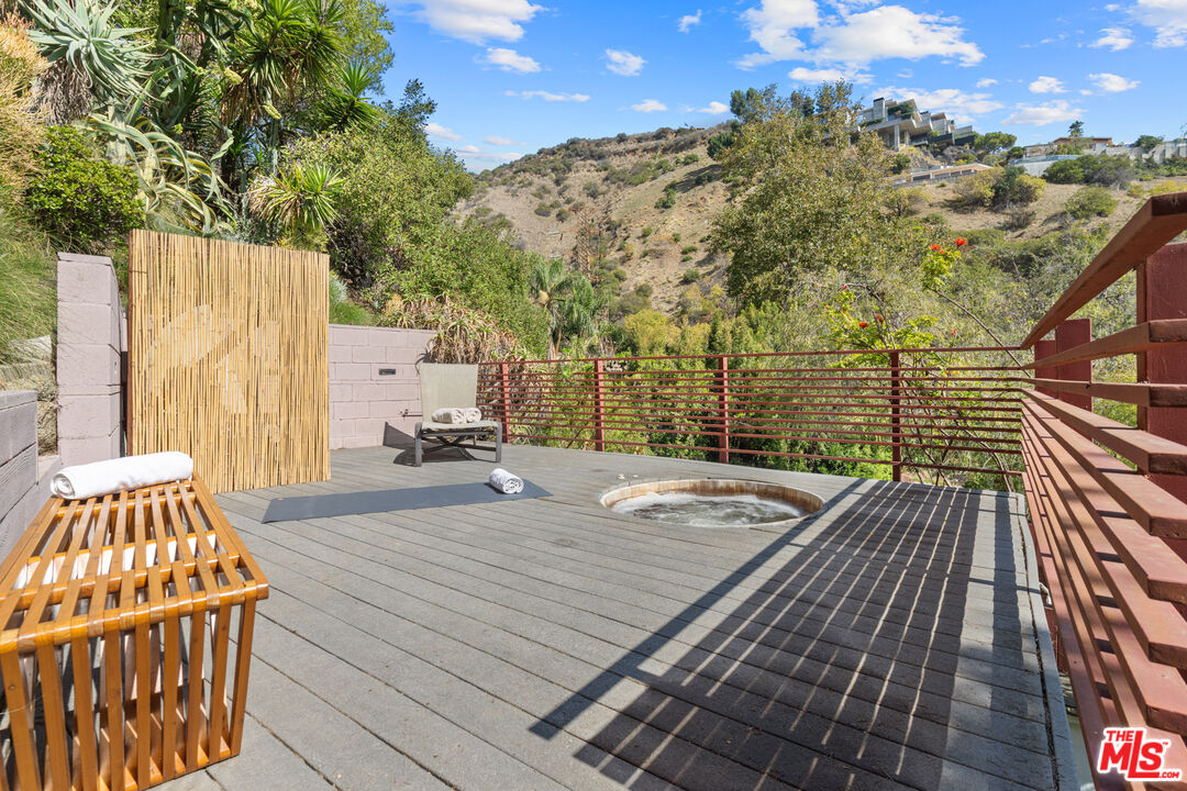 1853 Nichols Canyon Road Los Angeles, CA 90046 - Photo 38 of 48 a patio with table and chairs and potted plants