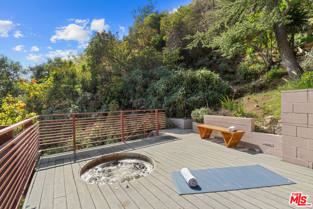1853 Nichols Canyon Road Los Angeles, CA 90046 - Photo 40 of 48 a view of a roof deck with wooden floor and fence