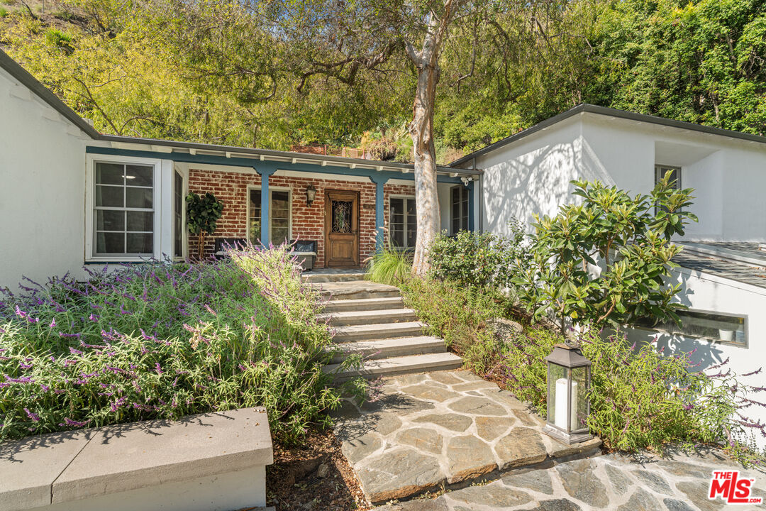1853 Nichols Canyon Road Los Angeles, CA 90046 - Photo 5 of 48 front view of a house with a yard