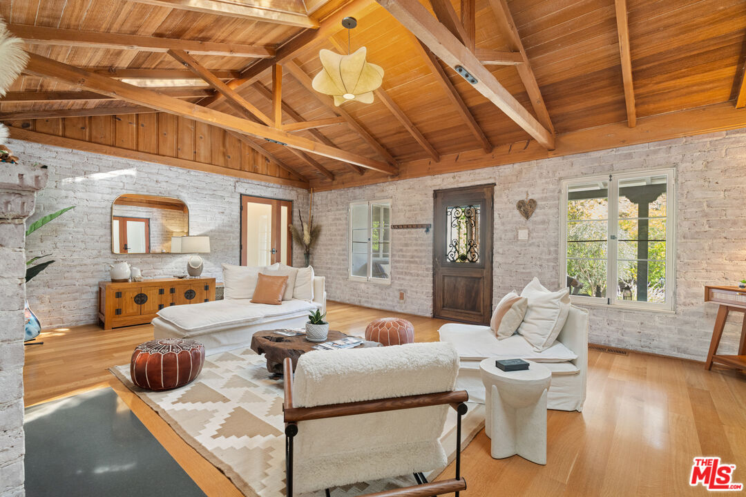 1853 Nichols Canyon Road Los Angeles, CA 90046 - Photo 8 of 48 a living room with furniture and wooden floor