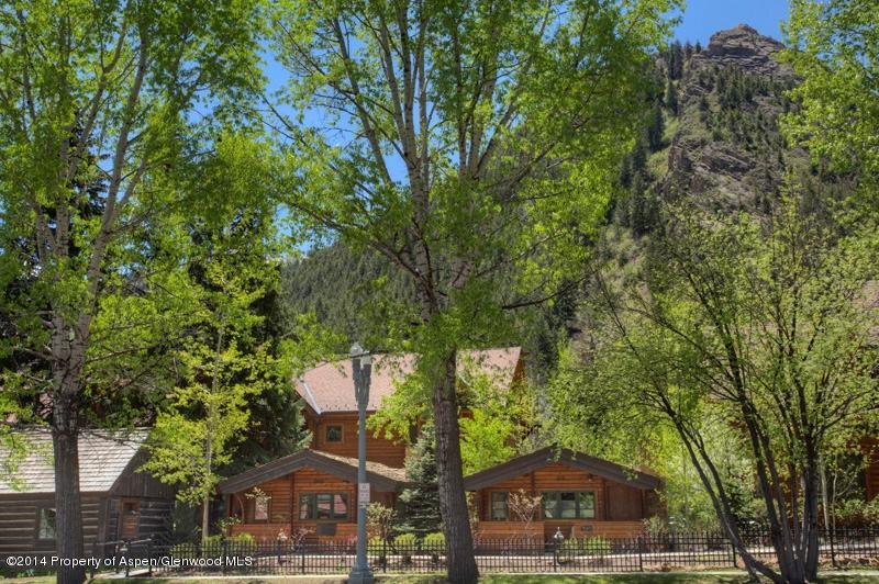 507 West Main Street, Unit C101 Aspen, CO 81611 - Photo 12 of 16 a front view of a house with a yard and large trees