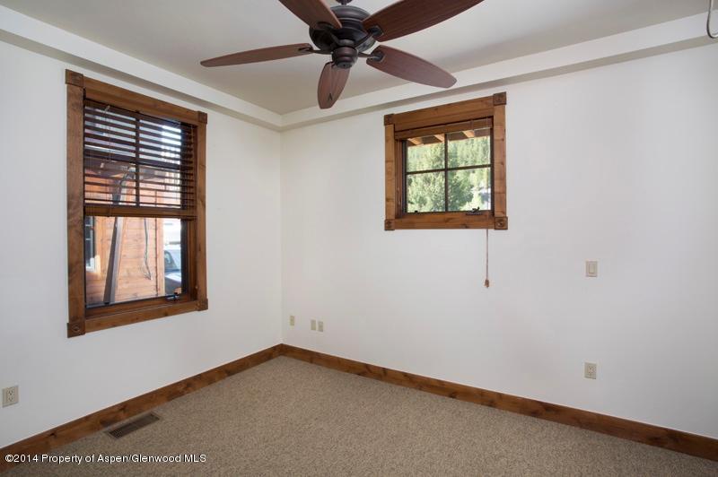 507 West Main Street, Unit C101 Aspen, CO 81611 - Photo 6 of 16 a view of an empty room with a window