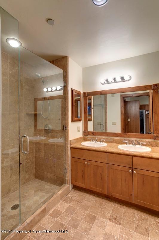 507 West Main Street, Unit C101 Aspen, CO 81611 - Photo 7 of 16 a spacious bathroom with a mirror sink and shower