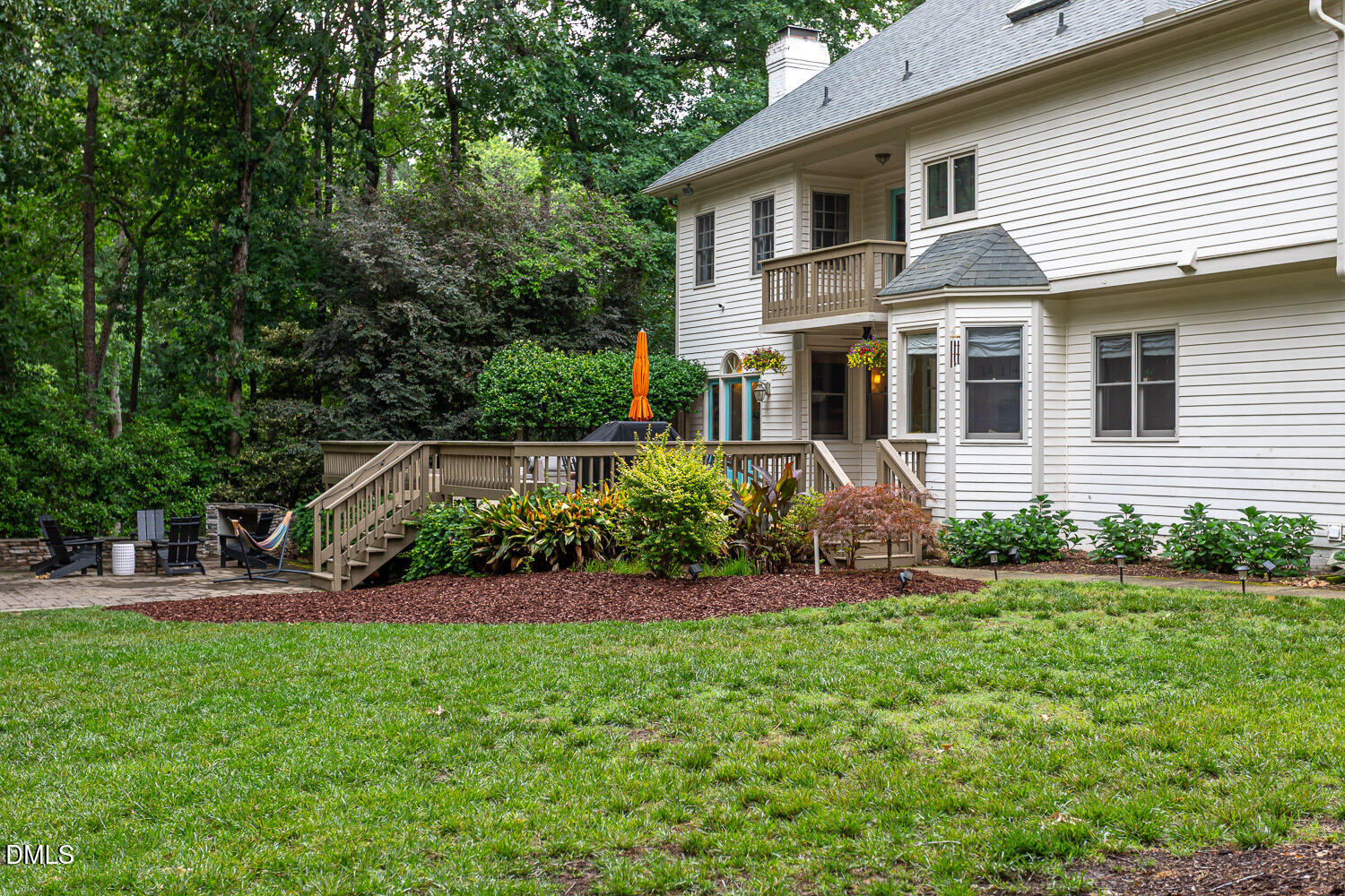8509 Towneley Place Raleigh, NC 27615 - Photo 33 of 36 a front view of a house with a yard and green space