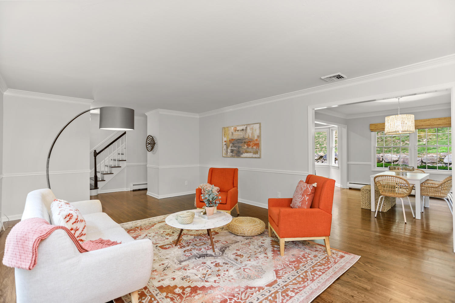 704 Valley Road New Canaan, CT 06840 - Photo 1 of 59 a living room with furniture a rug and a floor to ceiling window
