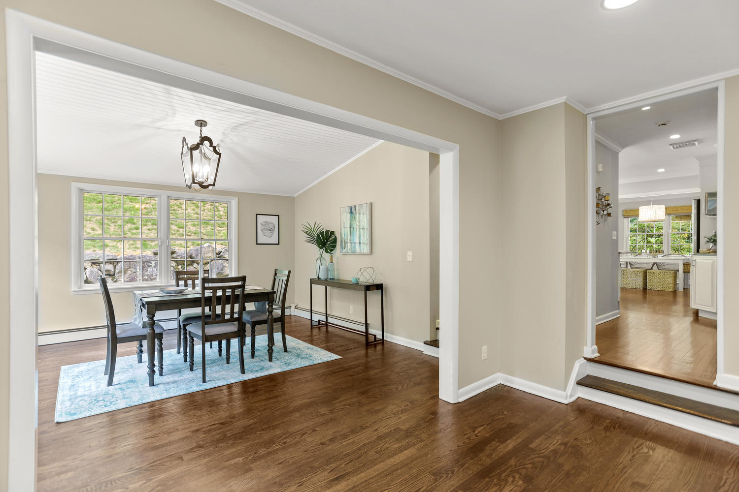 704 Valley Road New Canaan, CT 06840 - Photo 23 of 59 a view of a dining room with furniture and wooden floor