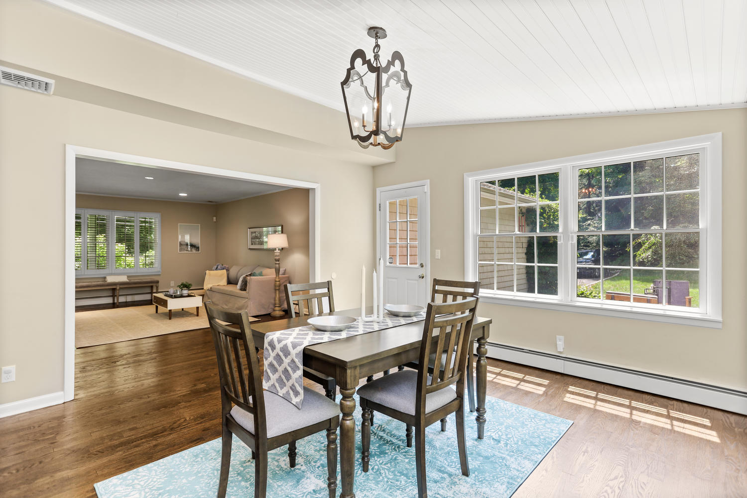704 Valley Road New Canaan, CT 06840 - Photo 24 of 59 a view of a dining room with furniture window and wooden floor
