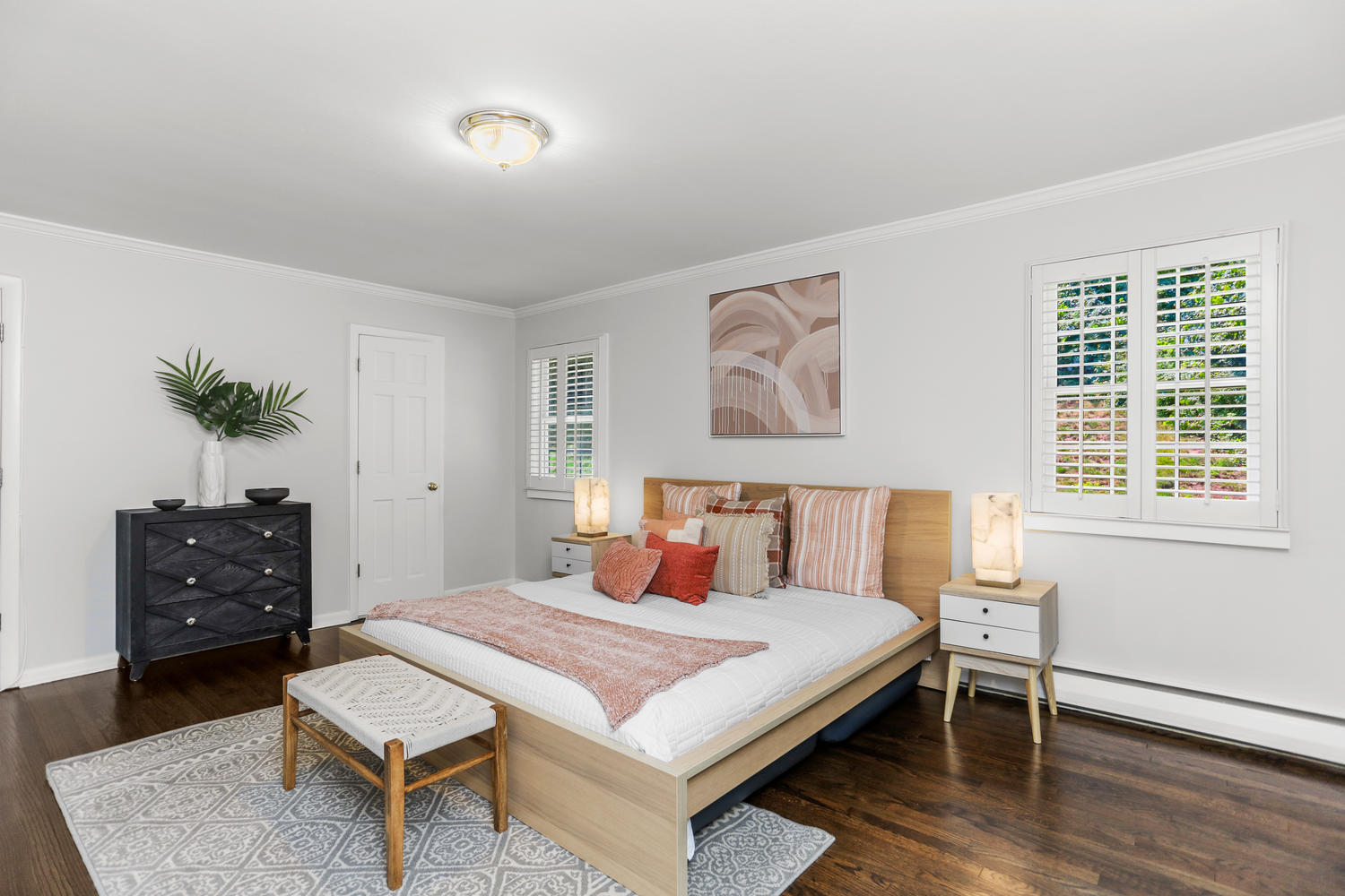 704 Valley Road New Canaan, CT 06840 - Photo 26 of 59 a bedroom with a bed and wooden floor