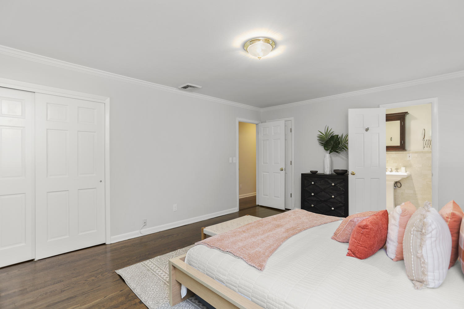 704 Valley Road New Canaan, CT 06840 - Photo 27 of 59 a bedroom with a bed and wooden floor