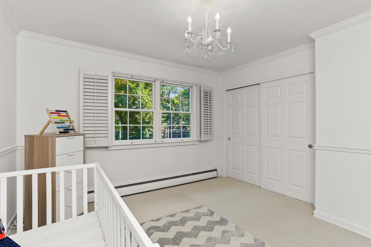 704 Valley Road New Canaan, CT 06840 - Photo 35 of 59 a view of a livingroom with wooden floor and a window