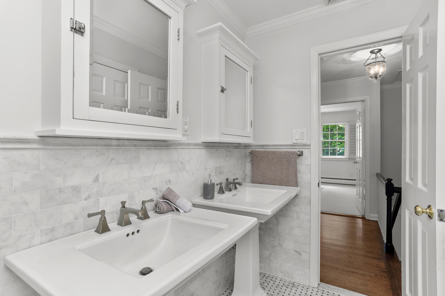 704 Valley Road New Canaan, CT 06840 - Photo 37 of 59 a bathroom with a sink and a mirror