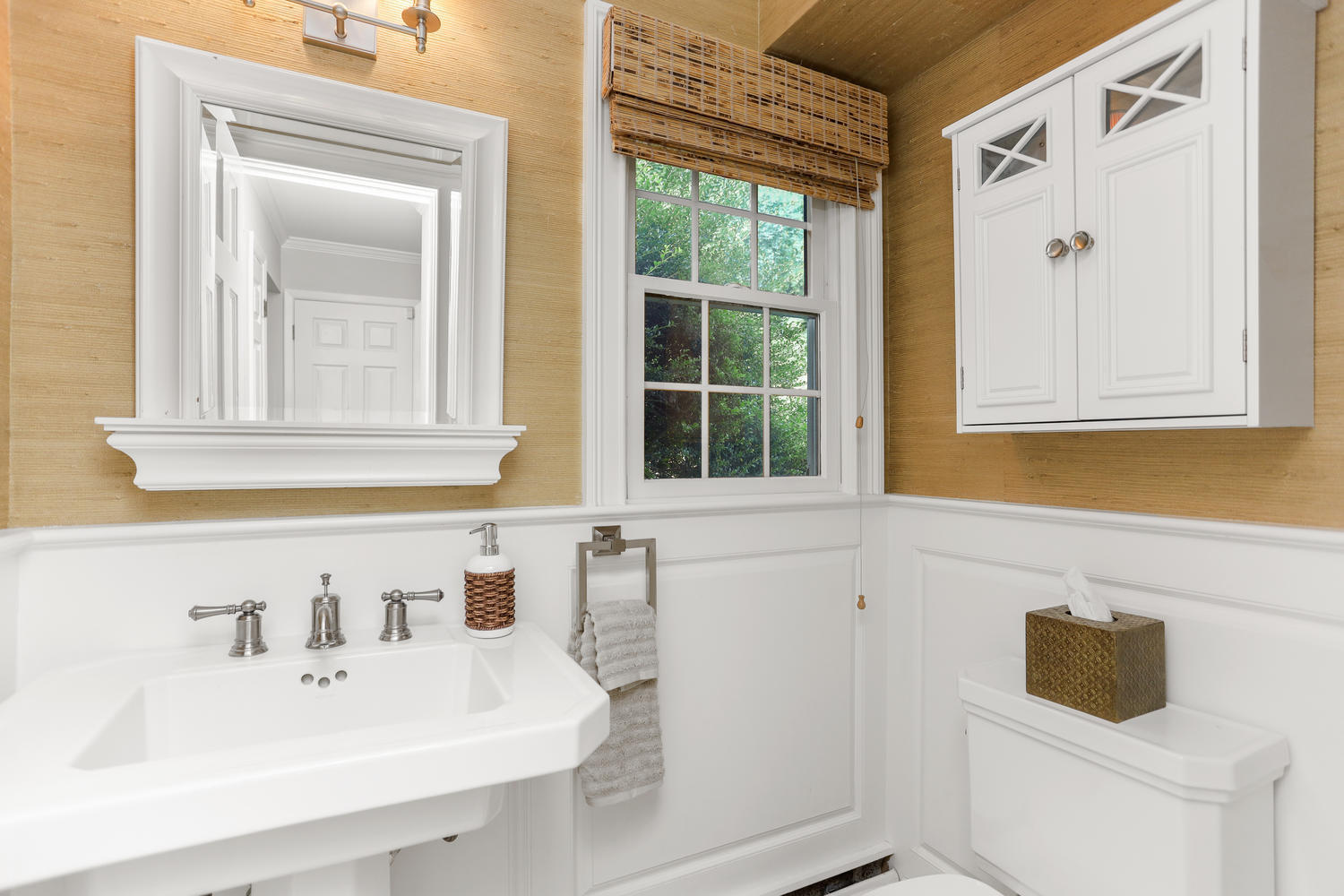 704 Valley Road New Canaan, CT 06840 - Photo 45 of 59 a bathroom with a sink and a window