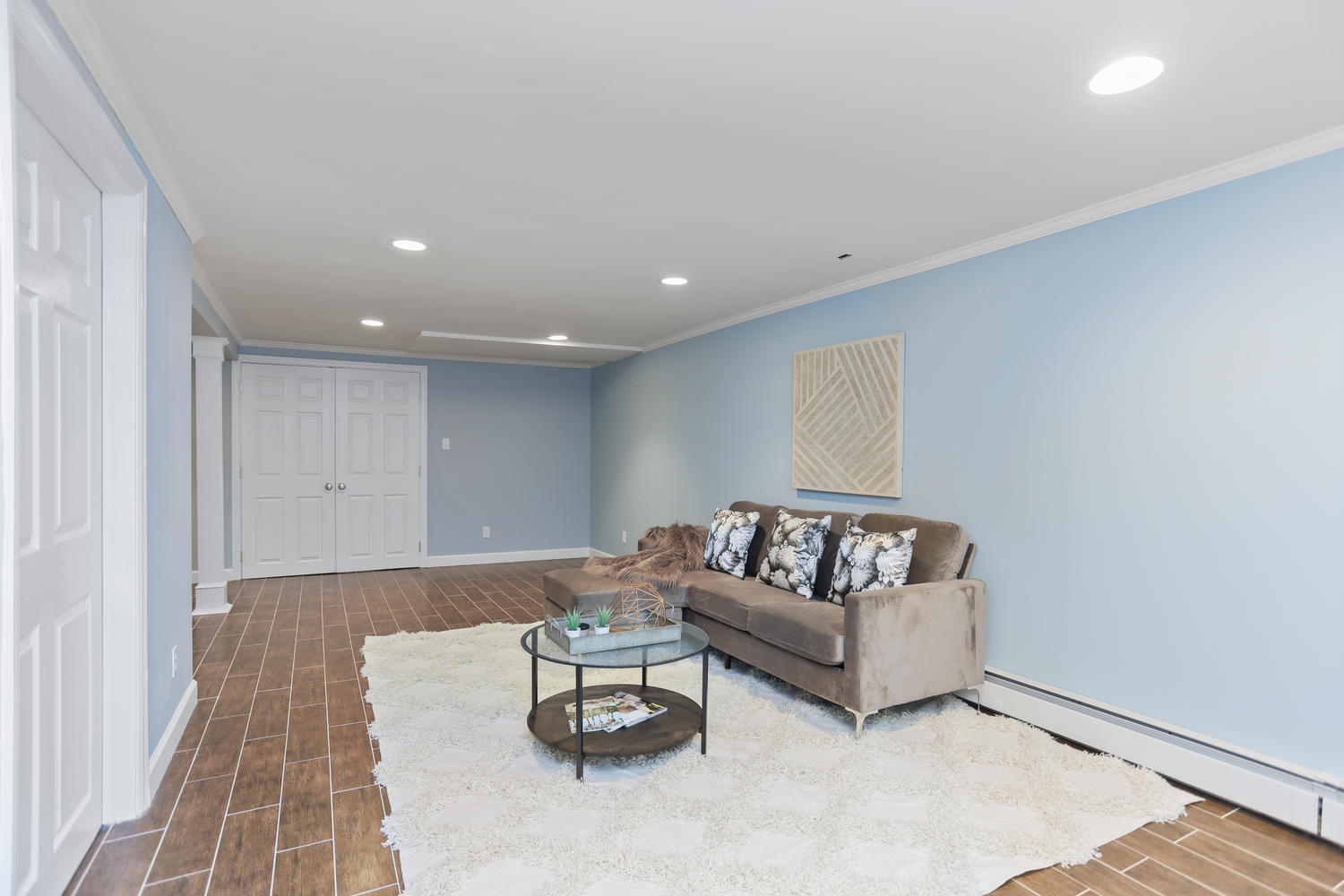 704 Valley Road New Canaan, CT 06840 - Photo 49 of 59 a living room with furniture and a couch