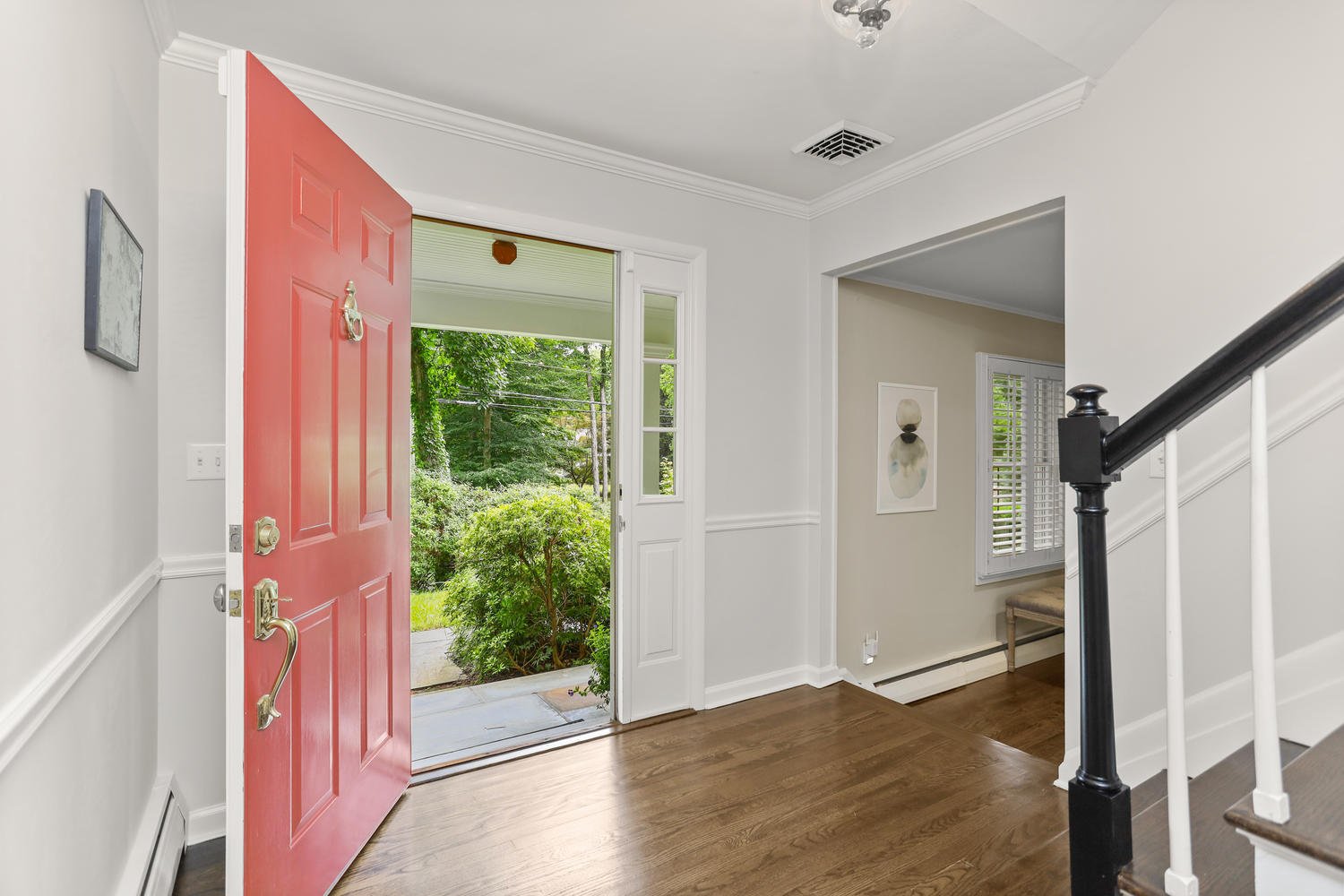 704 Valley Road New Canaan, CT 06840 - Photo 6 of 59 a view of a hallway with wooden floor and stairs