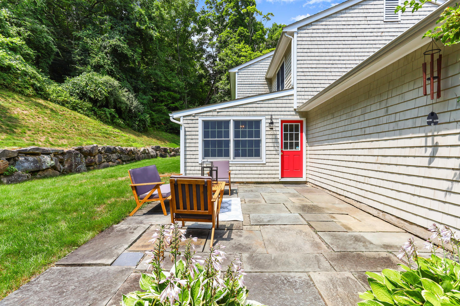 704 Valley Road New Canaan, CT 06840 - Photo 51 of 59 a view of backyard with table and chairs and potted plants